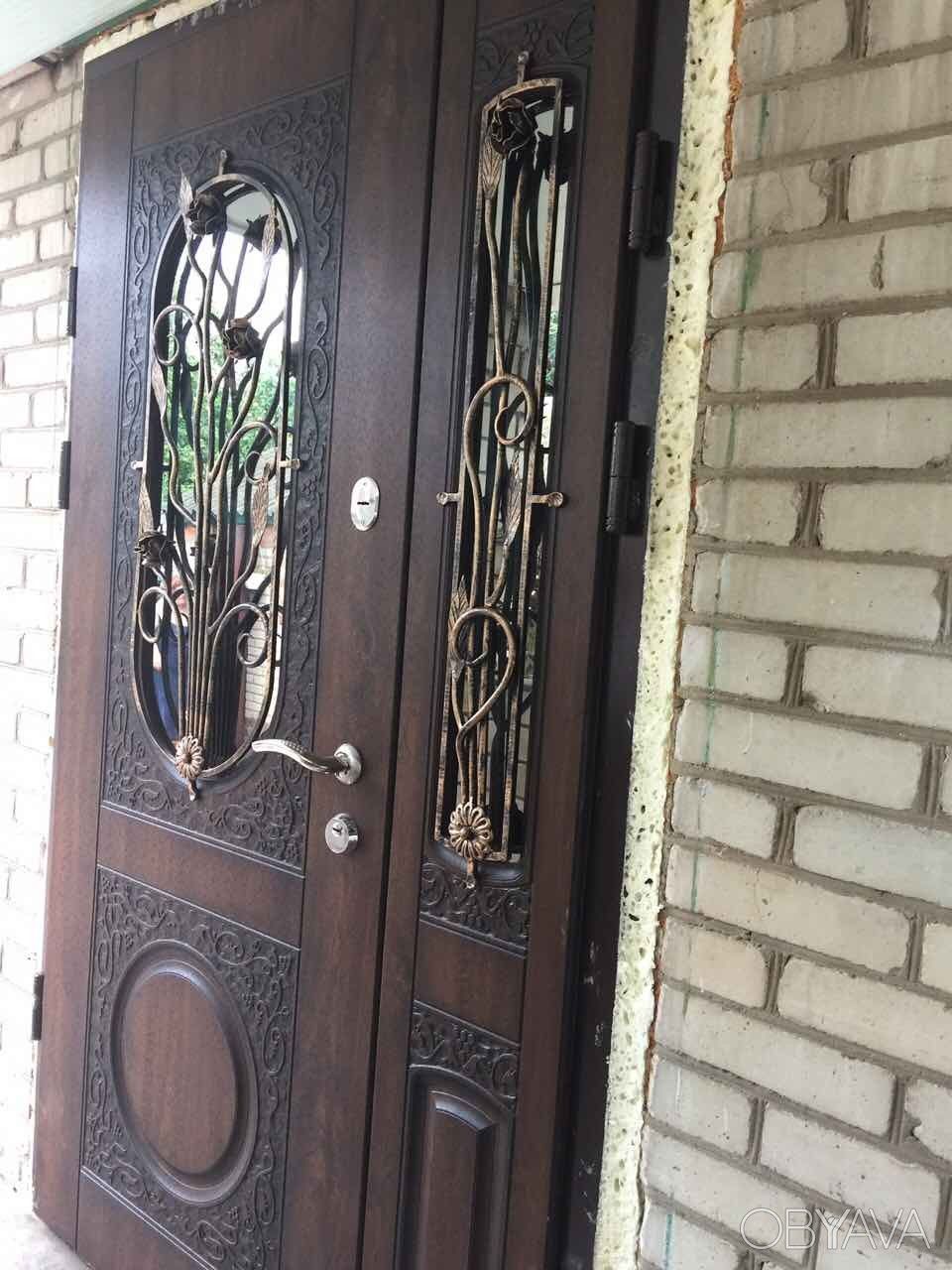 Железные входные двери с ковкой